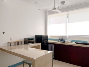 Fridge, microwave, stovetop, coffee/tea maker