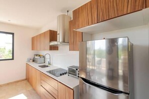 Fridge, microwave, stovetop, coffee/tea maker