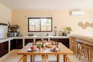 Fridge, microwave, stovetop, coffee/tea maker