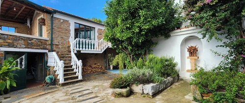 Enchanting converted wine cellar with panoramic views of the surrounding hills.