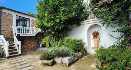 Enchanting converted wine cellar with panoramic views of the surrounding hills.