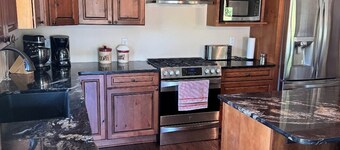 Lake House with Hot Tub, game room, huge yard, 1 mile from Silverlake Sand Dunes