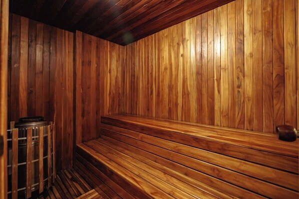A sauna with wooden walls and benches.