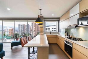 Fridge, microwave, stovetop, coffee/tea maker