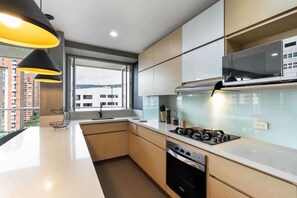Fridge, microwave, stovetop, coffee/tea maker