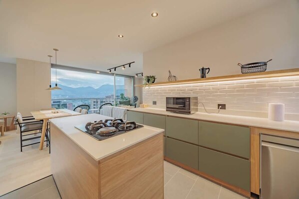 Fridge, microwave, stovetop, coffee/tea maker