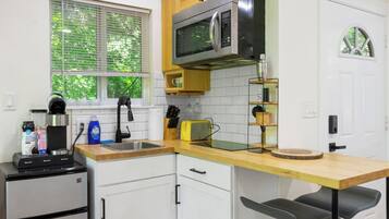 Fridge, microwave, stovetop, coffee/tea maker