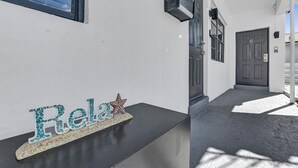 A building entrance with a 'Relax' sign, a star decoration, and a door marked with the number 5. - Waves on Desoto Studio With Pool 3 (Hollywood)