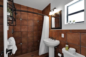 A bathroom with a shower, a sink, and a toilet. - Waves On Walnut 5-beach Access (Hollywood)