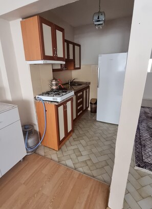 Apartment, Balcony, Beach View | Private kitchen | Full-size fridge, stovetop, cookware/dishes/utensils