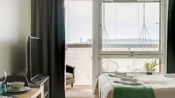 1 bedroom, desk, iron/ironing board, travel crib