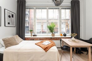 1 bedroom, desk, iron/ironing board, travel crib