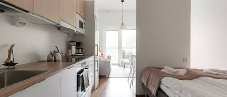 1 bedroom, desk, iron/ironing board, travel crib