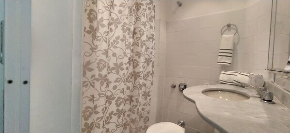 Hair dryer, towels, soap, toilet paper