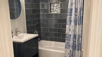 Shower, towels, soap, toilet paper