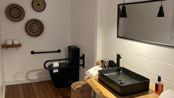 Combined shower/bathtub, deep-soaking bathtub, hair dryer, towels
