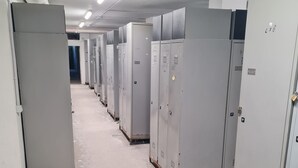 A row of large, grey electrical panels in a hallway. - Lodging in Artesina with Alpine view, ski-in/out, fireplace and sleeps 6 (Artesina)