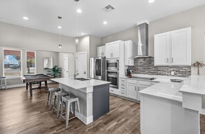 House, Multiple Beds, Pool Access (Cabana Cove Retreat Unit C) | Private kitchen | Fridge, microwave, oven, stovetop - Waterfront Condo With Rooftop + Pool + Boat Slips (Corpus Christi)