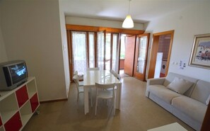 Apartment, 2 Bedrooms, Balcony, Garden View | Living room - First Floor Apartment in Lignano Riviera for 6 Guests (Lignano Sabbiadoro)