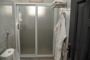 Shower, towels, soap, toilet paper