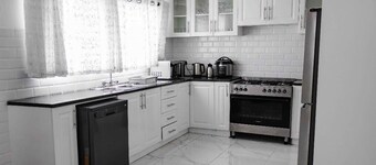 Serene four bedroom family home within walking distance of local amenities.