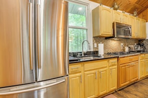 Fridge, microwave, stovetop, coffee/tea maker