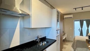 Fridge, microwave, stovetop, coffee/tea maker