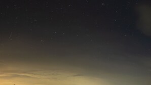 Two rustic, arched-roofed cabins with a clear night sky and stars visible above. - Bwthyn Bach Brefi (Tregaron)