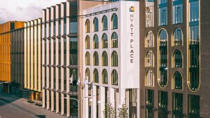 A modern building with a prominent 'Hyatt Place' sign, featuring a mix of architectural styles with arched windows and a flat facade. - Hyatt Place Tallinn (Tallinn)