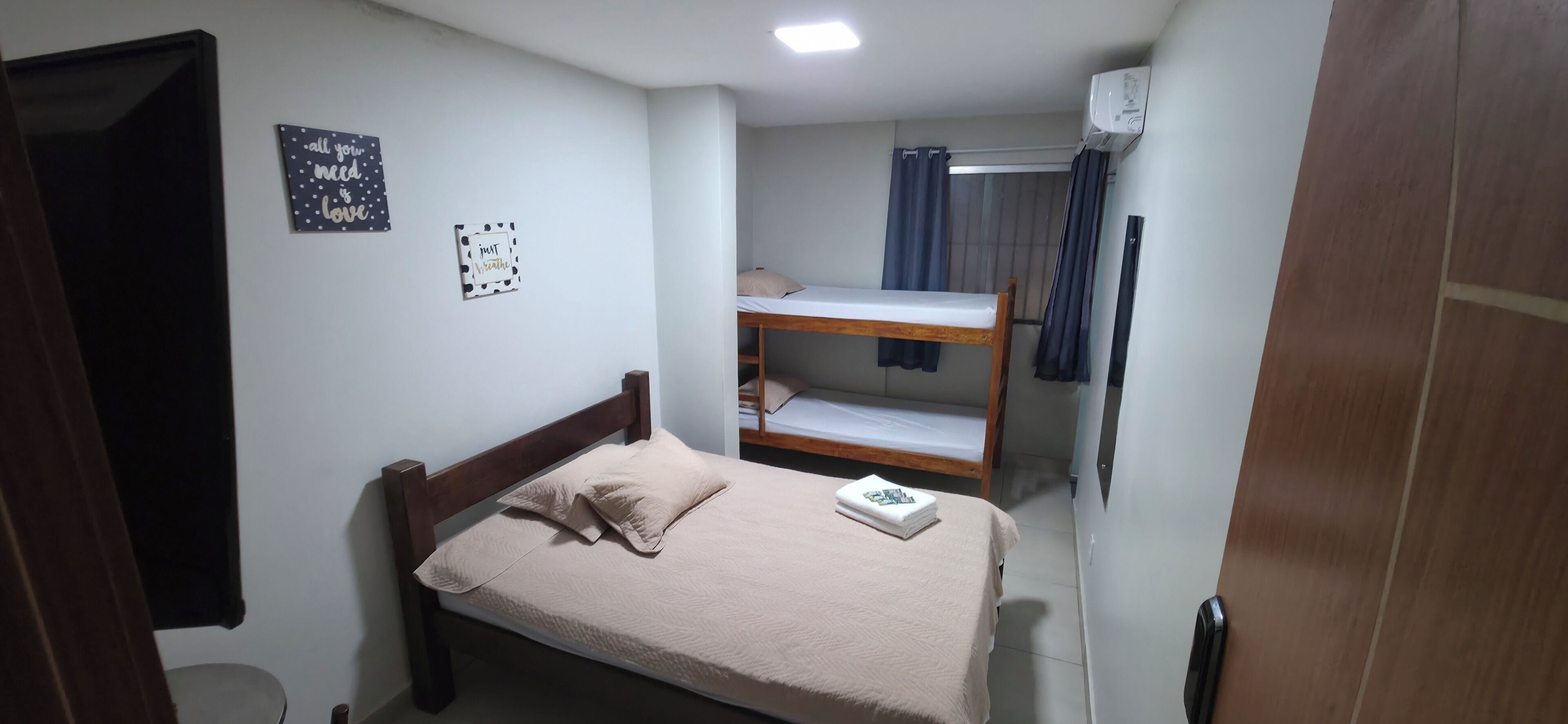 Deluxe Quadruple Room, City View | Iron/ironing board, free WiFi, bed sheets