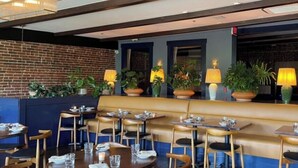 A restaurant with a brick wall, wooden seating, and potted plants. - SGV Quadruple Room + Explore Disney & Downtown LA (Alhambra)