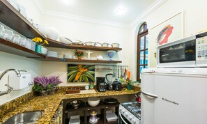 Deluxe Apartment, Balcony, Partial Ocean View | Private kitchen | Toaster, high chair