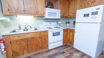 Microwave, coffee/tea maker, toaster, cookware/dishes/utensils