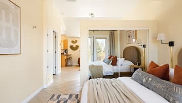 1 bedroom, desk, iron/ironing board, travel crib