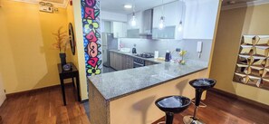Fridge, microwave, oven, stovetop - Stylish Miraflores Apt • Walk to Sea • WiFi • Optional AC • Parking (Miraflores)
