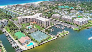 A resort with a marina, multiple swimming pools, and beachfront access.