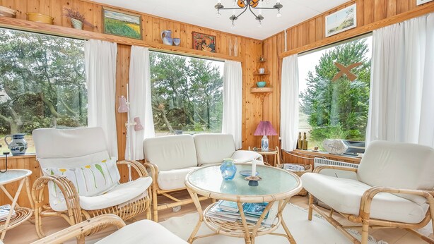 A room with wooden walls, white furniture, and large windows with curtains. - Lovely cottage close to the North Sea (Pandrup)