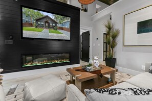 Smart TV, fireplace, books, music library