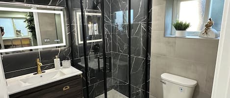 Shower, hair dryer, towels, soap
