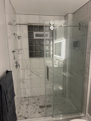 Shower, hair dryer, towels, soap