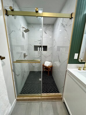 Shower, eco-friendly toiletries, hair dryer, towels