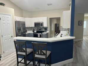 Microwave, oven, stovetop, dishwasher - 3-bedroom house in phenomenal Cape Coral with private yard and pool/spa (Cape Coral)