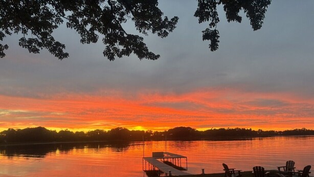 A lakeside view with a dock and chairs. - 3BR Sandy Pond LAKE HOUSE | Dock | Fire Pit | Pets (Pulaski)