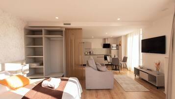 A modern hotel room with a bed, a sofa, a desk, and a TV.
