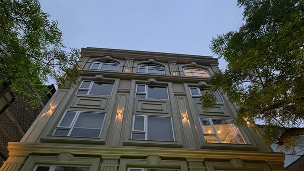 The exterior of the Kiwwinn Hotel with a prominent illuminated sign. - Kiwi Inn Hotel (Ujjain)
