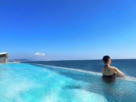 Outdoor pool, open 6:00 AM to 10:00 PM, pool umbrellas