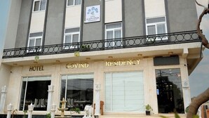A hotel building with a sign reading "Hotel Govind Residency". - Hotel Govind Residency (Mathura)