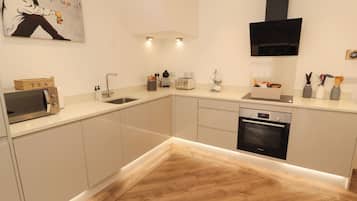 Fridge, microwave, cookware/dishes/utensils