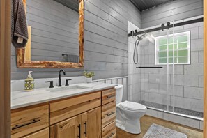 Shower, hair dryer, towels, shampoo