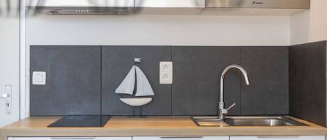 Fridge, microwave, stovetop, coffee/tea maker